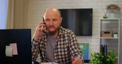 Man balancing work calls and personal conversations, balance evident in Stock Footage 301526281