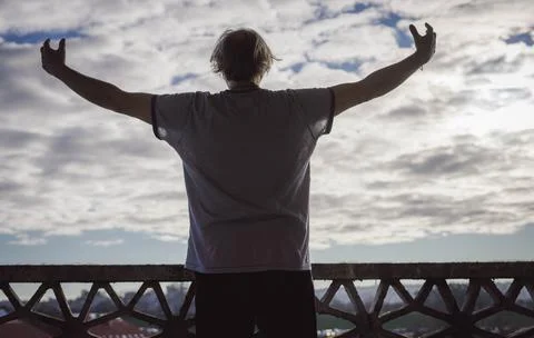 Man on a balcony in the sun Stock Photos