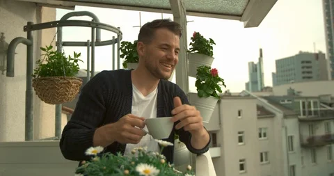 Man on balcony talks to someone Stock Footage 95326961