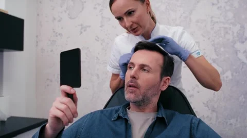 Man with baldness problem at the doctor Stock Footage 274140001