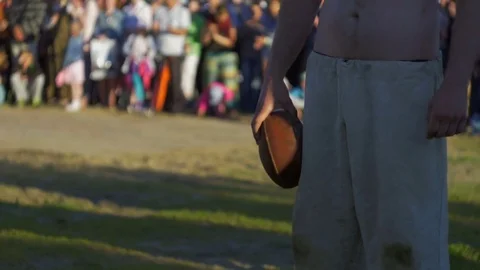 Man with a ball laughs and waves his hand Stock Footage 82409451