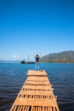 The man on bamboo bridge Stock Photos