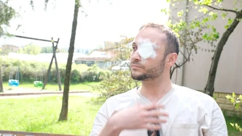 Man with bandaged eye Stock Footage 257698197