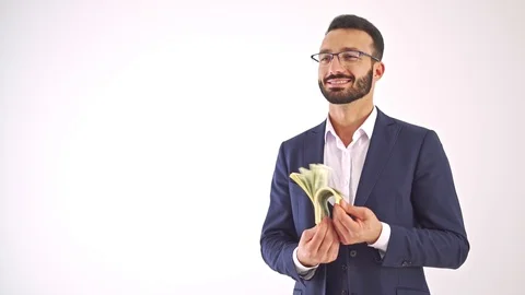 The man with banknotes standing on the white background. slow motion Stock Footage 104537931