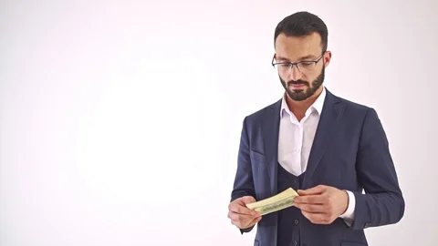 The man with banknotes standing on the white background. slow motion Video stock 104538075