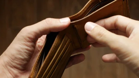 Man bankrupt arrears showing empty wallet with no money. Poverty finance Stock Footage