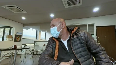 Man at Bar Close Up While Wears Medical Mask During Covid-19 Pandemic Stock Footage 141385825