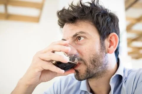 Man at the bar drinking coffee Stock Photos