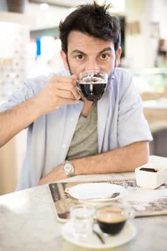 Man at the bar drinking coffee Stock Photos