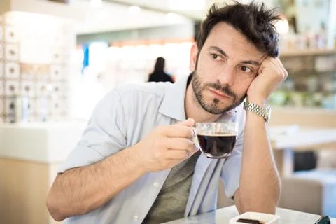 Man at the bar drinking coffee Stock Photos