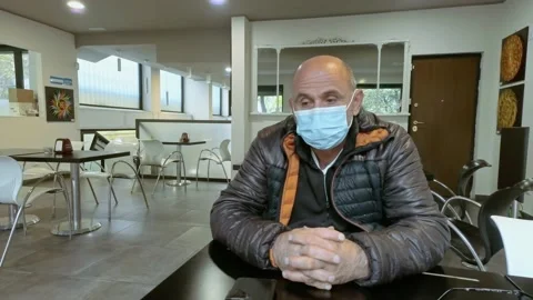 Man at Bar While Wears Medical Mask During Covid-19 Pandemic Stock Footage 141385727