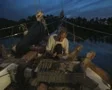 Man barbecuing food on boat deck SD Footage