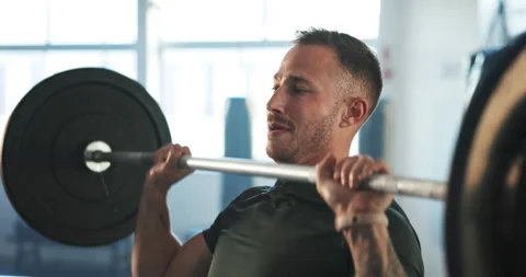 Man, barbell and press exercise in gym for workout, functional training or Video stock 249163123
