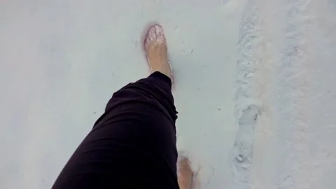 Man barefoot in the snow Video stock 146776329