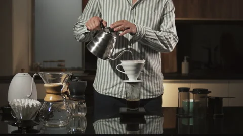 Man Barista making filter coffee on bar counter, alternative brewing, colombian Stock Footage 140517945
