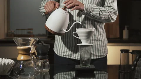Man Barista making filter coffee on bar counter, alternative brewing, colombian Stock Footage 141605702