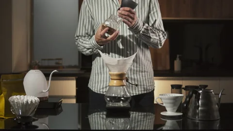 Man Barista making filter coffee on bar counter, alternative brewing, colombian Stock Footage 142455458