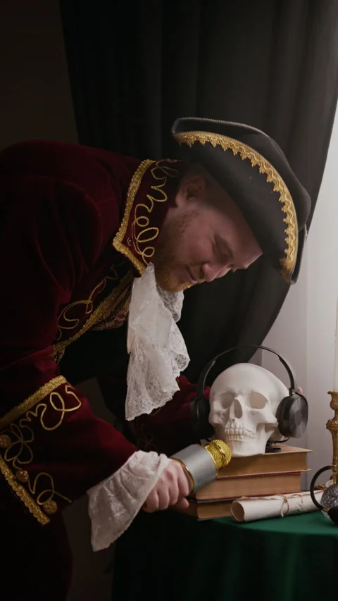 Man in Baroque Outfit Performing Comedy Song with Skull Model and Microphone Stock Footage 333567487