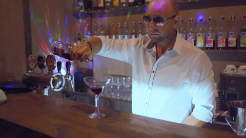 Man bartender working on brew dip and drop fruit cocktail to make fruit cockt Stock Footage 95936361