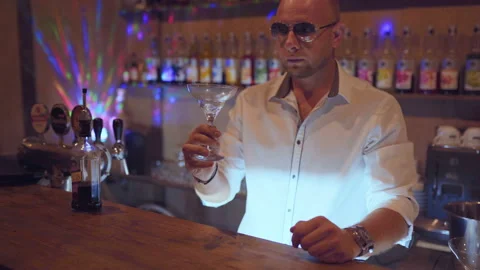 Man bartender working on brew dip and drop fruit cocktail to make fruit cockt Video stock 95936851