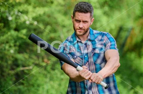 Man with baseball bat. i am a criminal. outdoor sport activity. Hooligan man Stock Photos