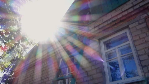 A man in a baseball cap and a plaid shirt descends from the attic up the wood Stock Footage 210360093