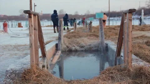 The  man bathes in an ice-hole on the Epiphany in Russia Stock Footage 59185482