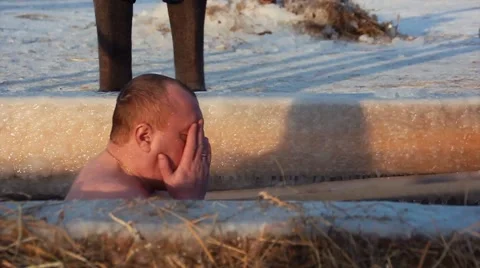 The  man bathes in an ice-hole on the Epiphany in Russia Stock-Footage 59185665