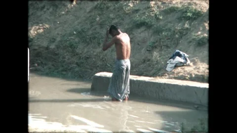 Man Bathing in Canal Video stock 276292794