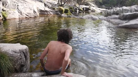 Man bathing in a mountain river at Pedriza in Sierra de Guadarrama in Spain Stock Footage 339346660