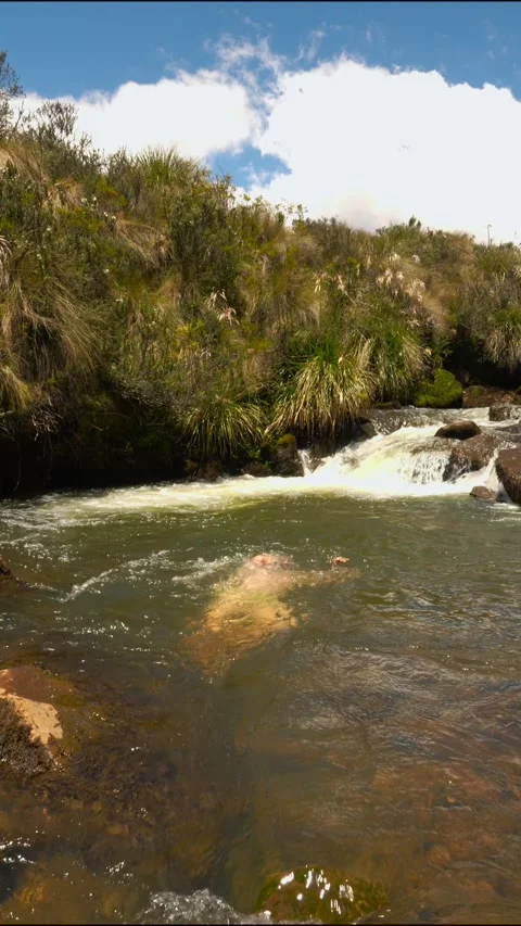 Man bathing in a river in Ecuador Stock Footage 311259182