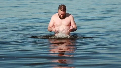 Man bathing in the river Stock Footage 92054736