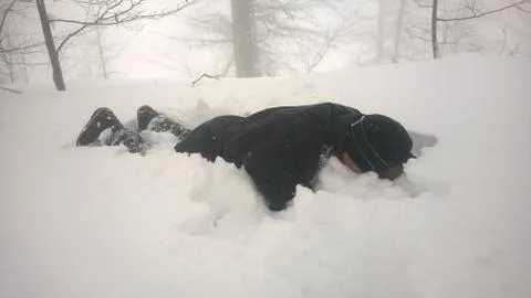 Man bathing in the snow Stock Photos