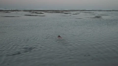 Man Bathing Soaking Laying on Water at The Beach Video stock 201429940