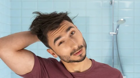 Man in bathroom Stock Footage 103962898