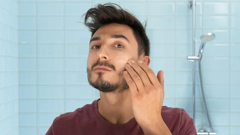 Man in bathroom Stock Footage 103968238