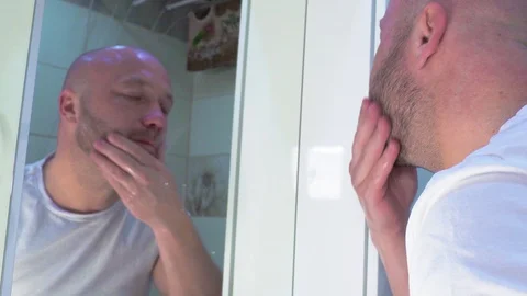 Man in the bathroom in isolation Stock Footage 127857150