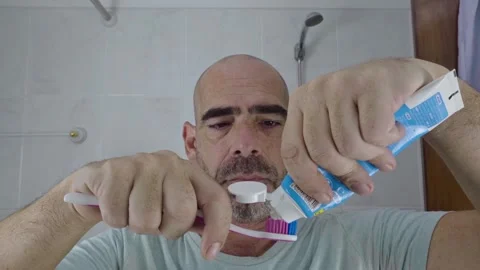 Man in bathroom shaving his beard Stock Footage 288093367
