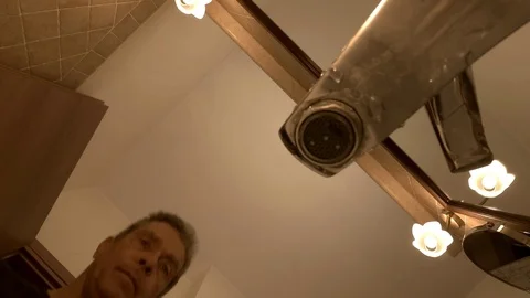  A man in a bathroom washes his face, close up view from the sink under the wate Stock Footage 103165791