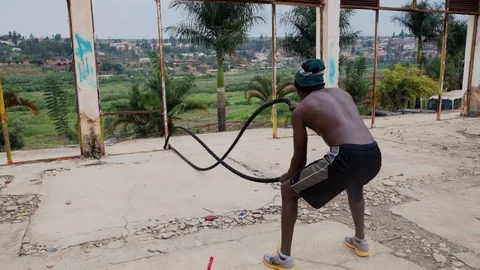 Man with battle rope ropes exercise Stock Footage 115708890