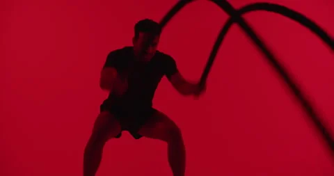 Man, battle ropes and exercise at gym with fitness in studio, equipment or Video stock 330924824