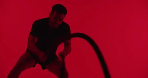 Man, battle ropes and workout at gym with fitness in studio, equipment or muscle Video stock 330998407