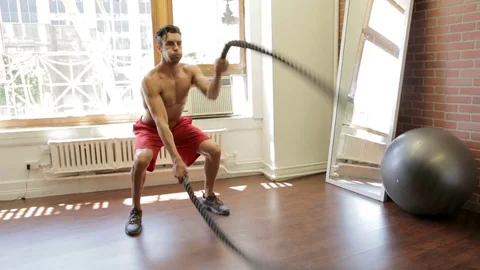 Man battle ropes 스톡 동영상 76734498