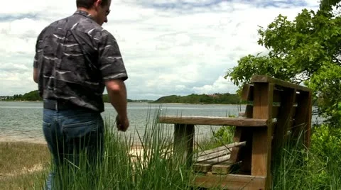 Man on beach bench Cape Cod Stock Footage 12082107