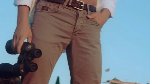 The man on the beach with binoculars Stock Footage 81056591