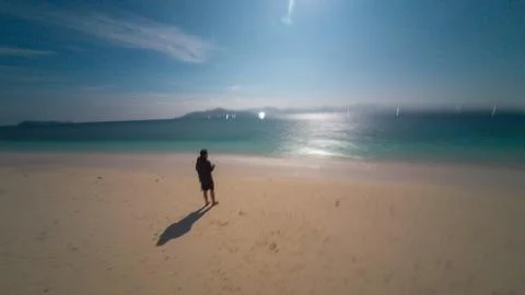 Man on a Beach at Dusk Stock Photos