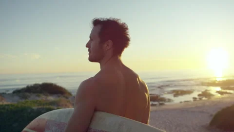 Man at the beach with his surfboard Stock Footage 279784535