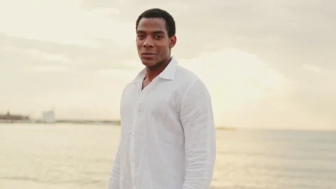 Man on Beach at Sunset Enjoying the View Stock Footage 303289295
