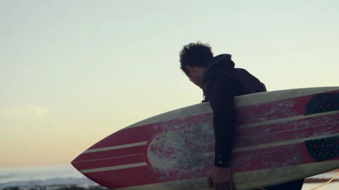 Man at the beach with a surfboard Stock Footage 279000994