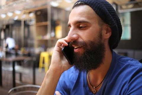 Man with bead is calling Stock Photos